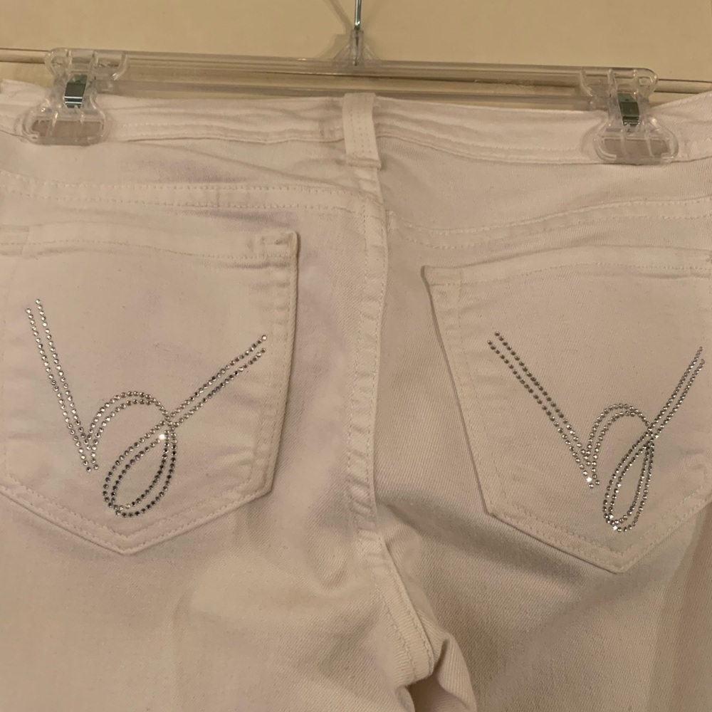 Bebe White jeans with crystals on the pockets
